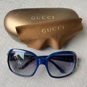 Authentic Gucci sunglasses with signature Gucci bamboo side accents.